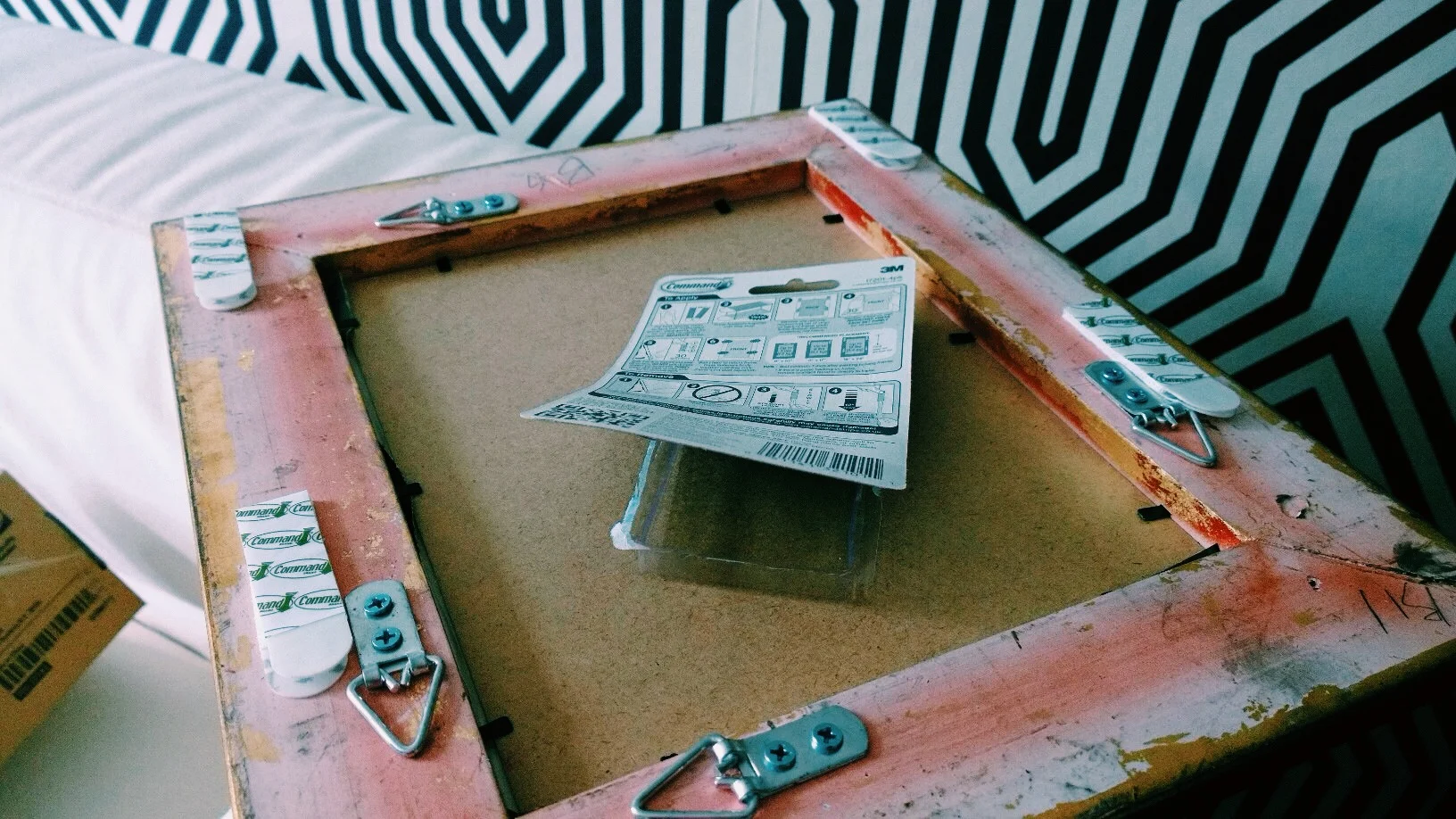 HANGING PICTURES WITHOUT NAILS — SARAH AKWISOMBE