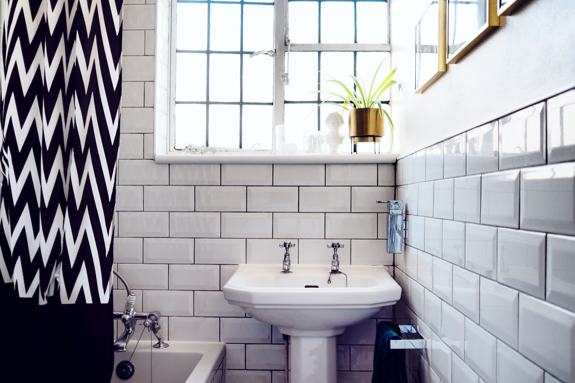 Really pleased with how this blush pink and green bathroom makeover turned out! It works so well with the white subway tiles and dark grout. The brass accents just finish it off!