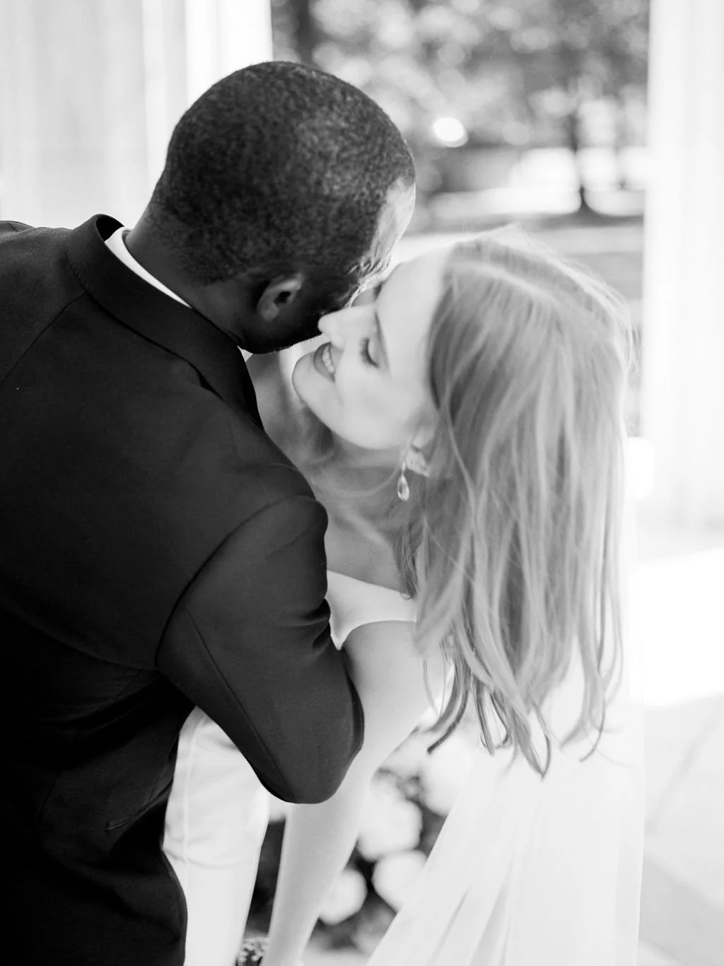 Bride and groom during intimate wedding ceremony at DC War Memorial on the National Mall in Washington DC.