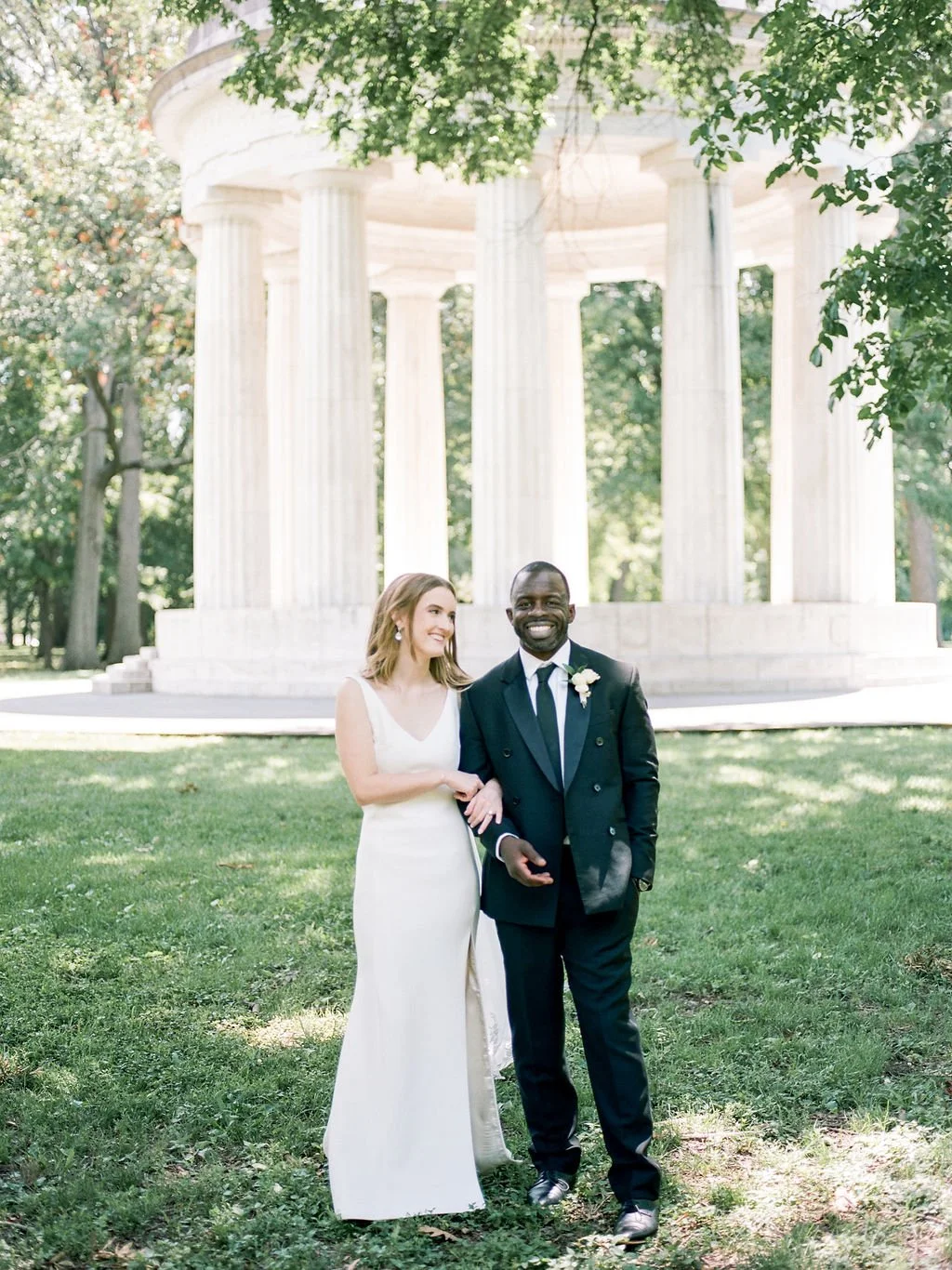 Bride and groom during intimate wedding ceremony at DC War Memorial on the National Mall in Washington DC.