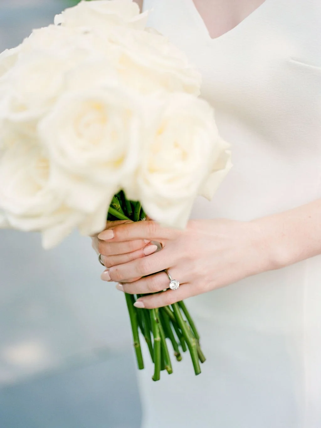 Bride and groom during intimate wedding ceremony at DC War Memorial on the National Mall in Washington DC.