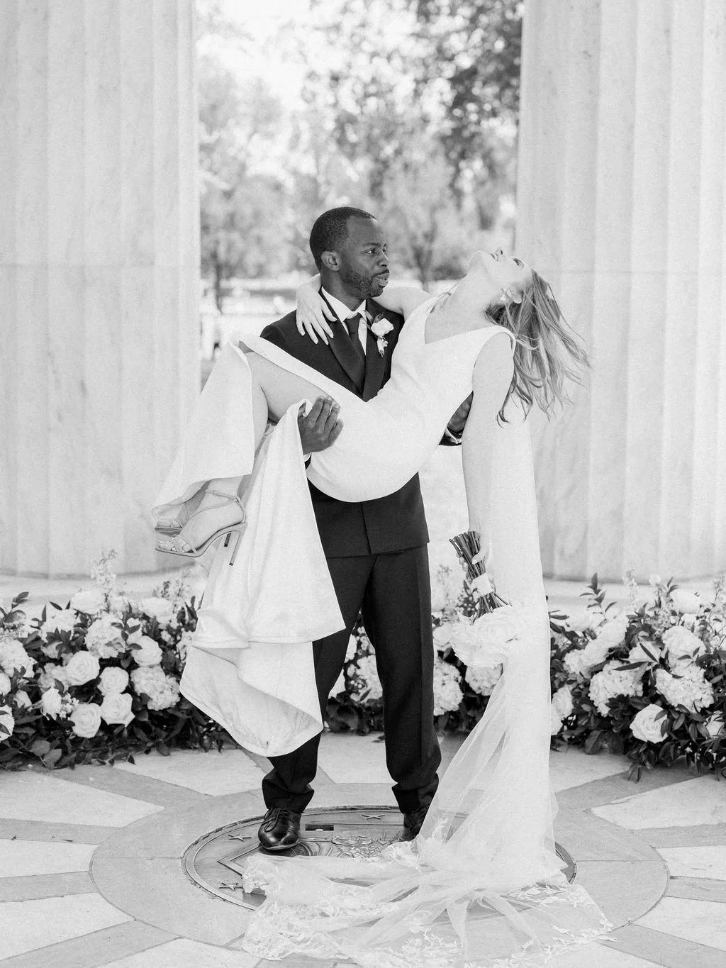 Bride and groom during intimate wedding ceremony at DC War Memorial on the National Mall in Washington DC.