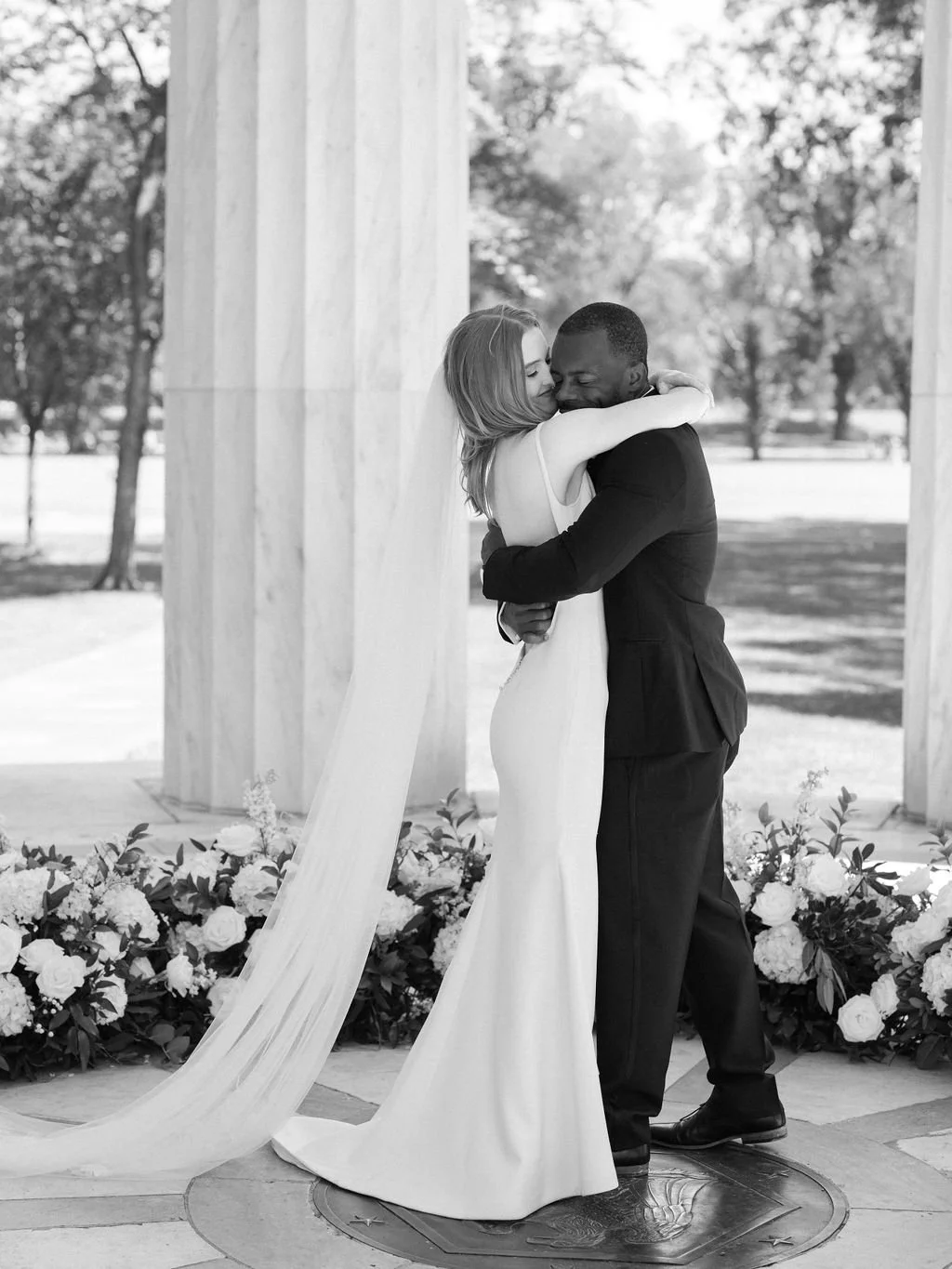 Bride and groom during intimate wedding ceremony at DC War Memorial on the National Mall in Washington DC.