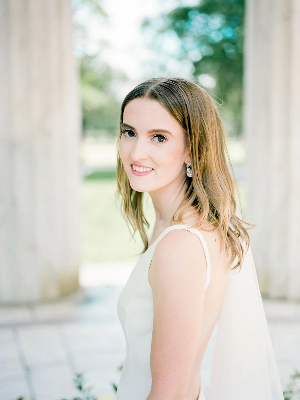 Bride and groom during intimate wedding ceremony at DC War Memorial on the National Mall in Washington DC.
