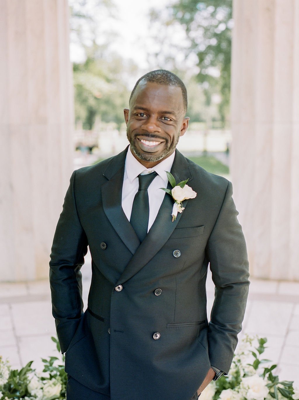 Groom portraits during intimate wedding ceremony at DC War Memorial on the National Mall in Washington DC.