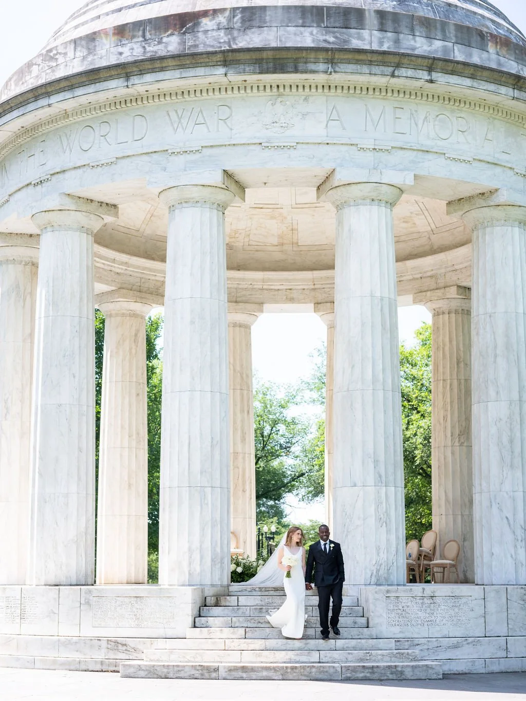 Bride and groom during intimate wedding ceremony at DC War Memorial on the National Mall in Washington DC.