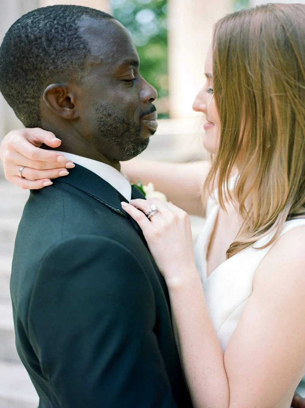 Bride and groom during intimate wedding ceremony at DC War Memorial on the National Mall in Washington DC.