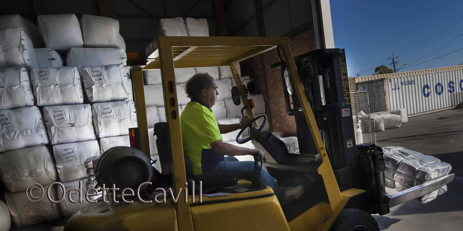 The Busines of Recycling - Loading the container with bailed cha