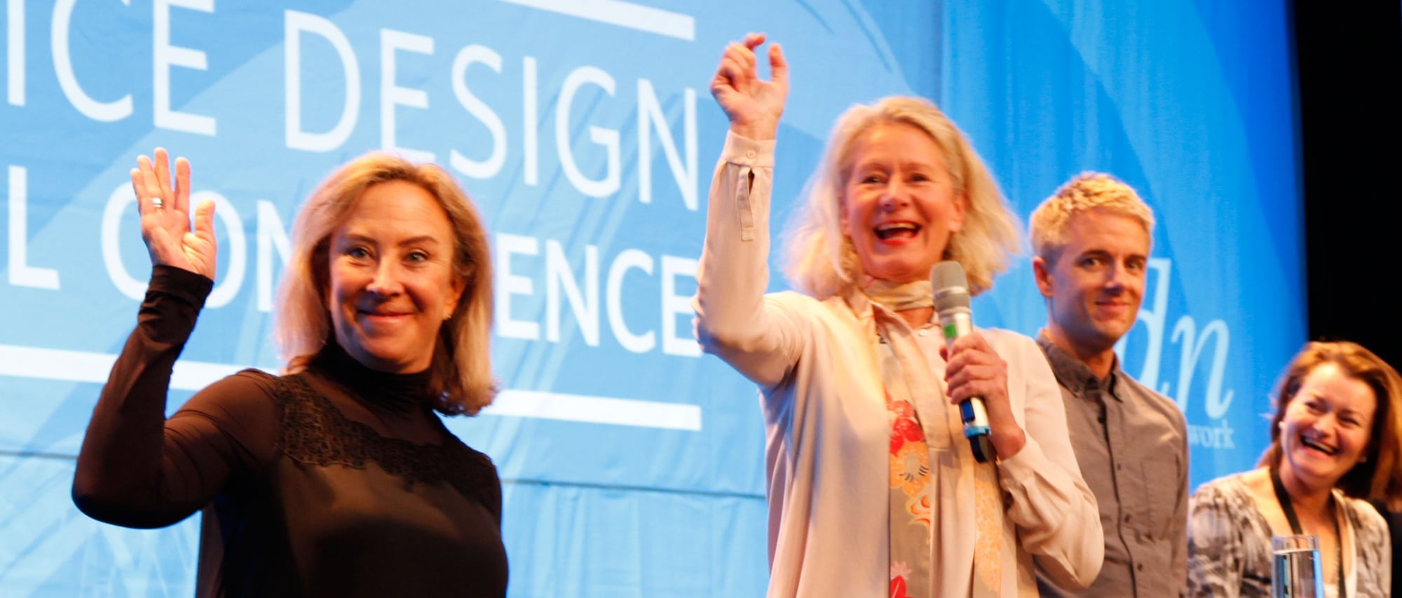 Mager and Evenson stand with the other conference organizers at the SDN Global Conference in 2014 in Stockholm.