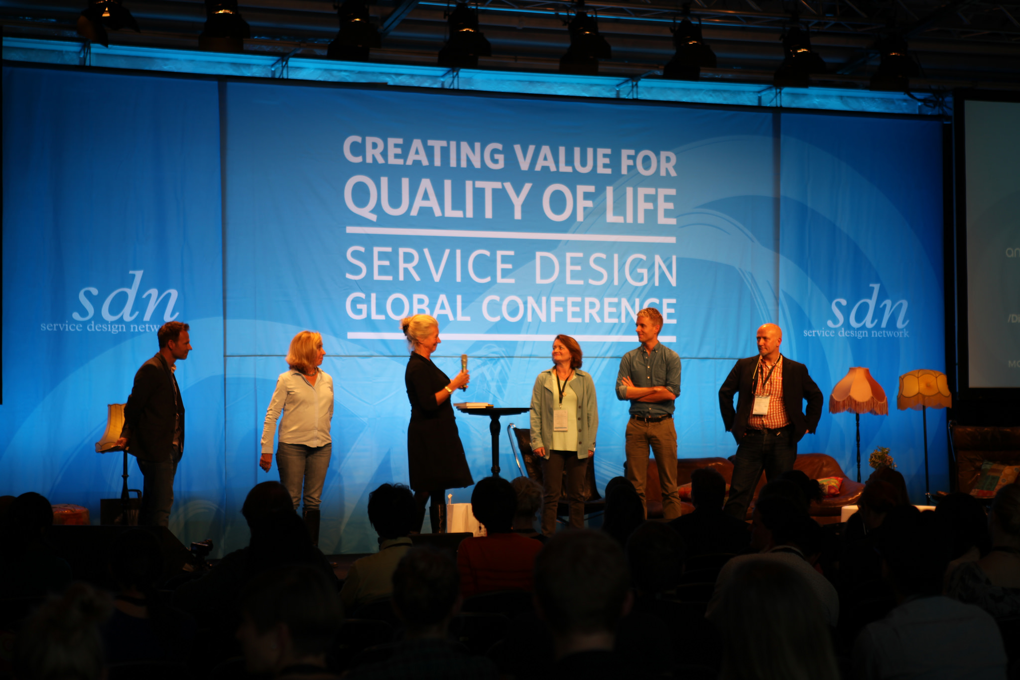 Evenson and Mager stand with other conference organizers at the SDN Global Conference in 2014 in Stockholm.