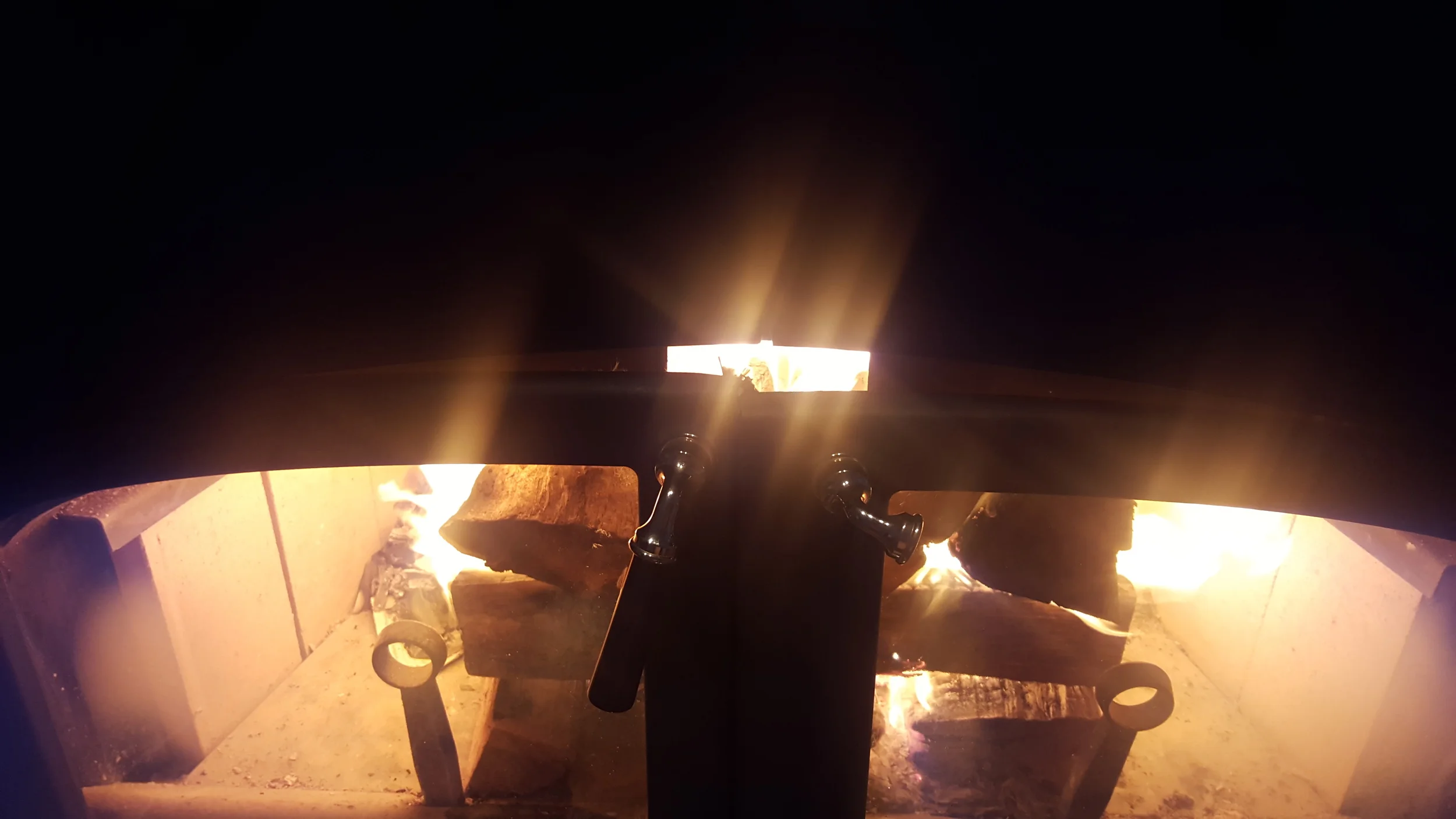 Doors closed partially allowing air to be drawn in by the fire itself accelerating the burn