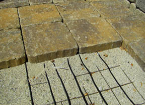Paver bricks laid over heating element