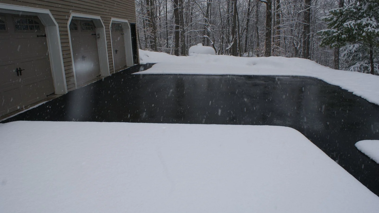 Driveway and walkway warm enough to melt snow as it falls