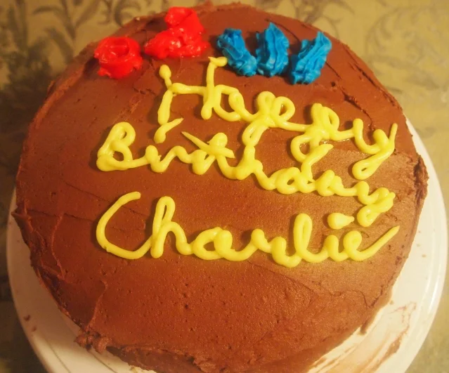 Triple layer vanilla cake with strawberry jam in the center with chocolate buttercream.