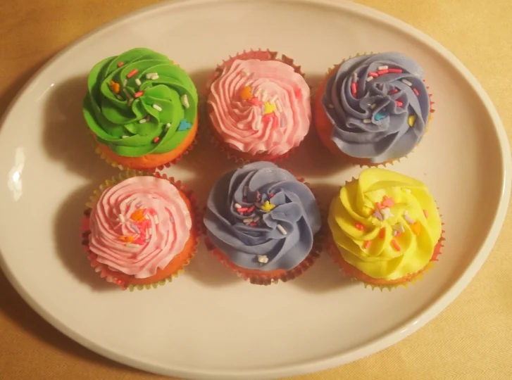 Pink velvet cupcakes in pastel and Spring colors.