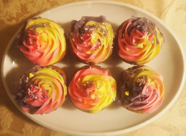 Carrot cake cupcakes - frosted with a mix of Spring colors.