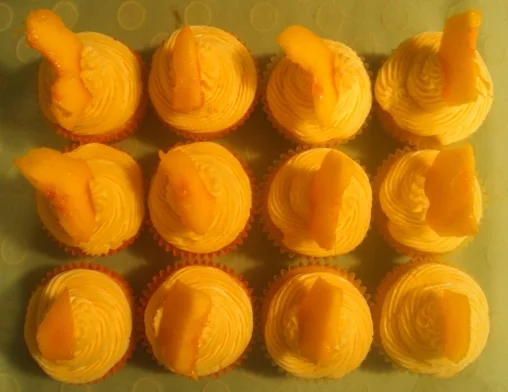 Peach Cupcakes - with natural peaches folded and buttercream that smells like peaches.