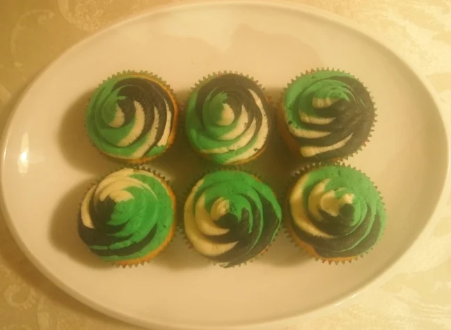 Vanilla cupcakes with icing swirled in the colors of the winning team (Philadelphia Eagles).