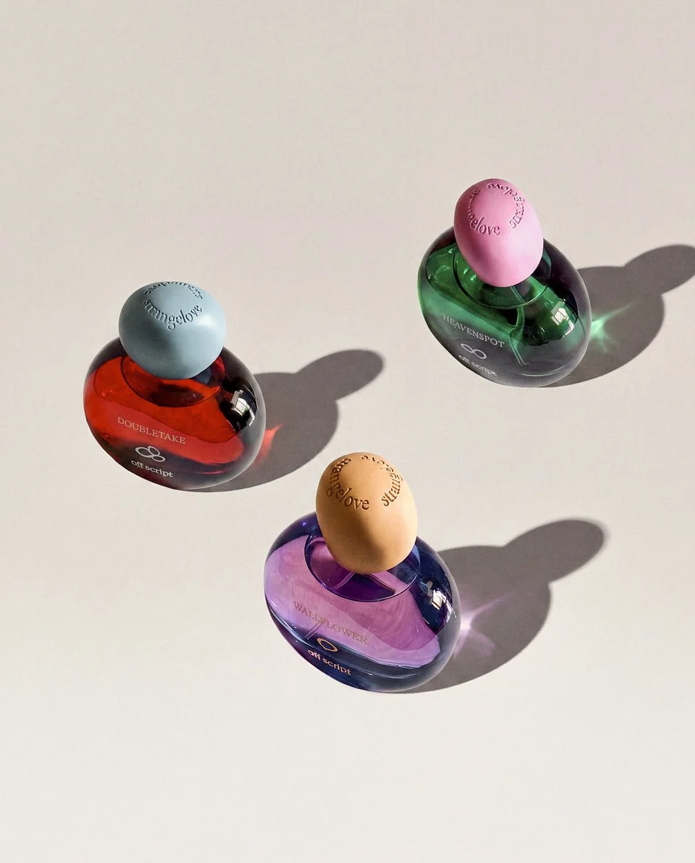 off script three colored Perfume bottles LE MILE Magazine