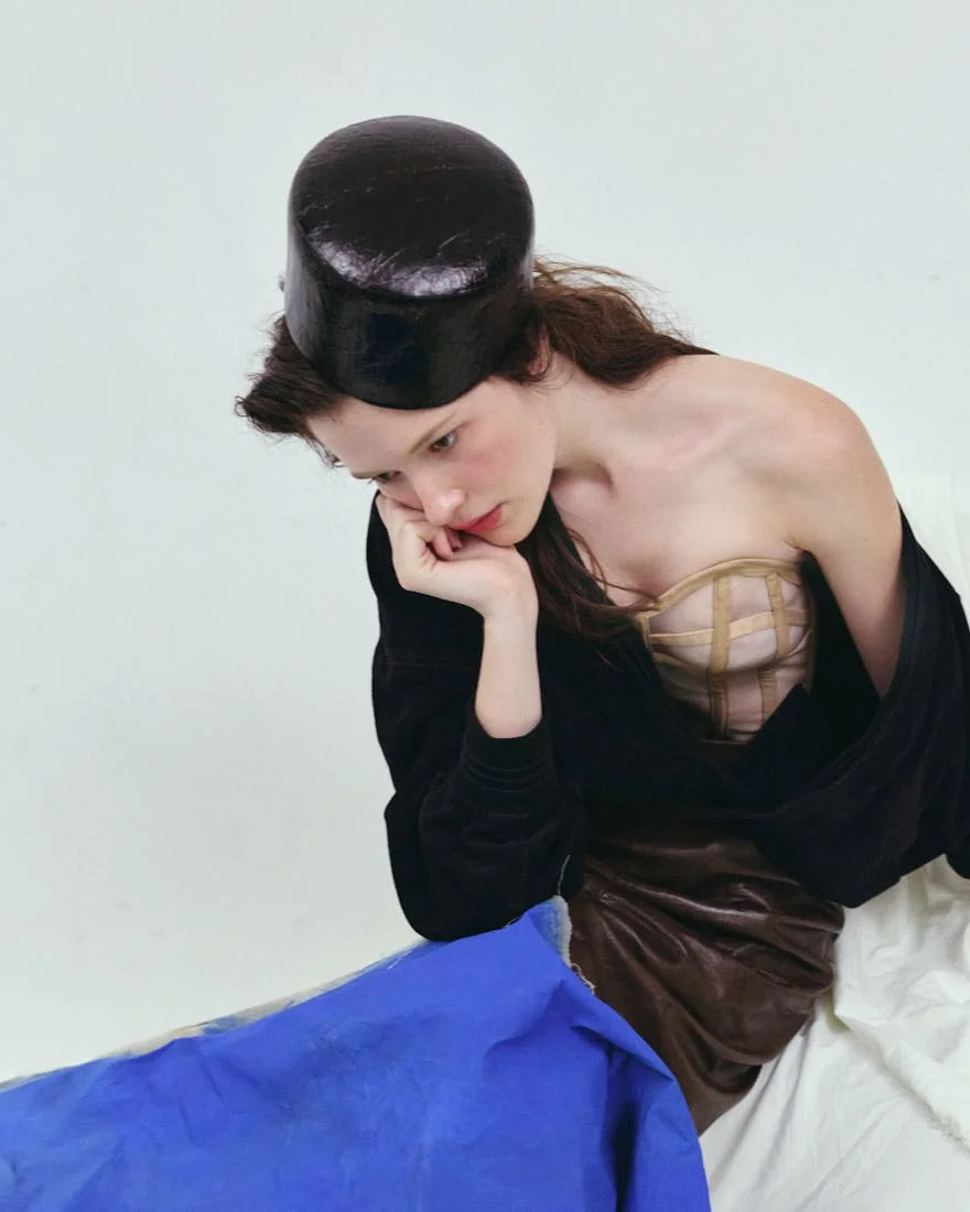 MADDIE STANLEY SS26 Editorial for LE MILE Magazine Maddie wears bomber jacket by VERSACE, corset by LORENZO SEGHEZZI, skirt by CASELL, shoes by APEPAZZA, and hat by BONFILIO