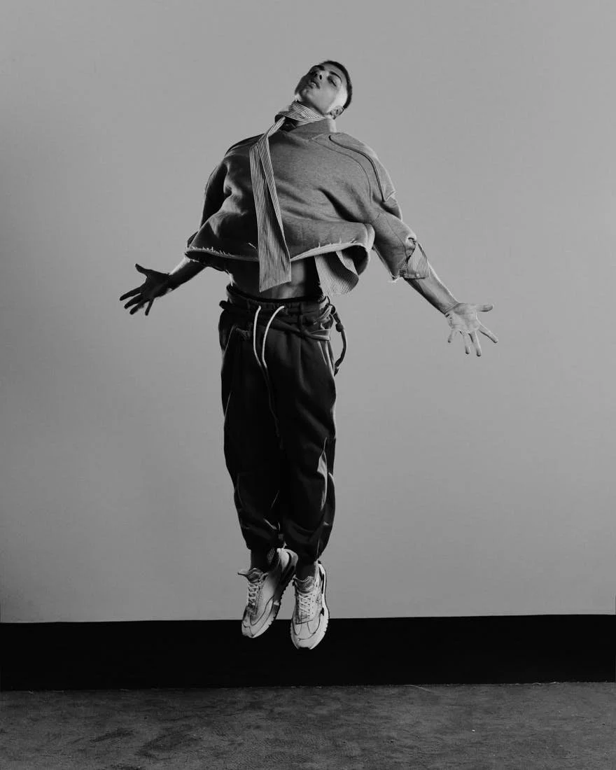 LE MILE Magazine Dancer Simone Emili editorial photo Cosimo Buccolieri Simone wears a sweater by MORDECAI, a shirt by MANUEL RITZ, pants by ACT N1, and shoes by BEPOSITIVE