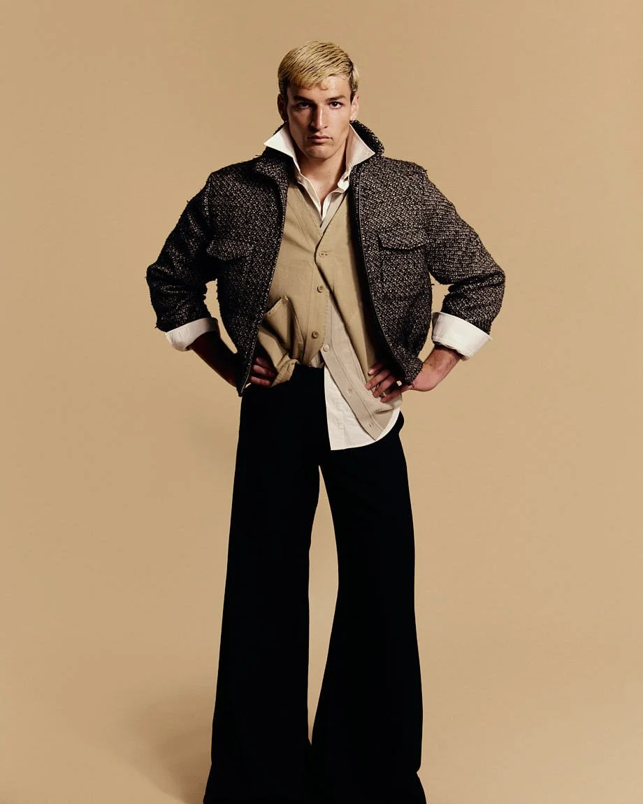 LE MILE Magazine Milhan Bouzidi SS26 Editorial Milhan wears jacket by RANDOM IDENTITIES by Stefano Pilati, vest by LABO.ART, cardigan by SON OF A TAILOR, shirt by LOUIS VUITTON and pants by DIESEL