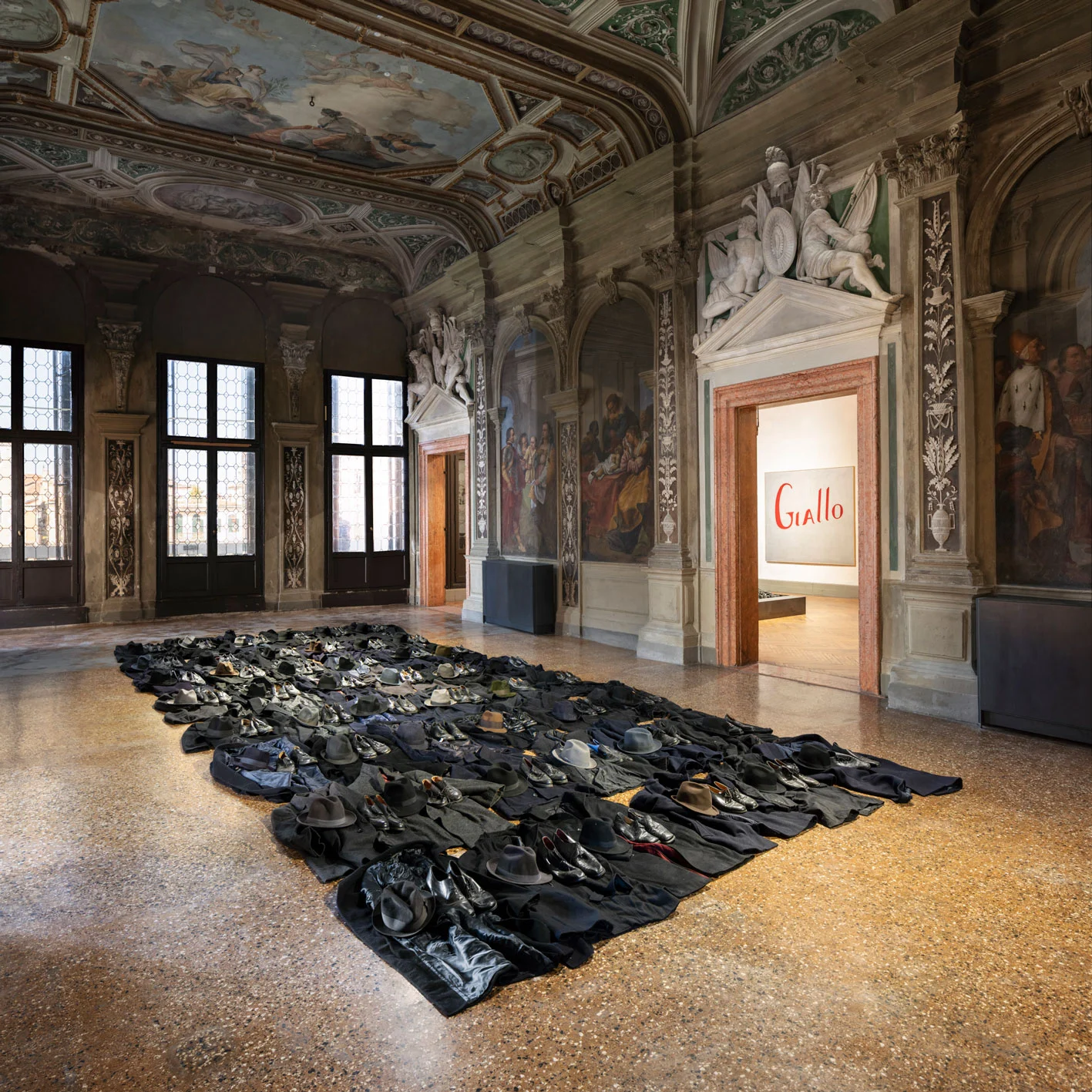 Jannis Kounellis Untitled, 2011 coats, hats, shoes in the background Jannis Kounellis Untitled (Giallo), 1965 oil on canvas