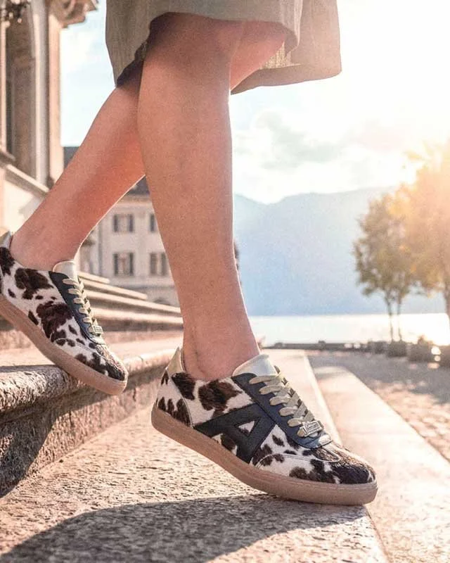   The form settles low and controlled, with a sole that introduces a measured lift while keeping the overall proportion compact, allowing the upper to remain close to the foot and uninterrupted in …  