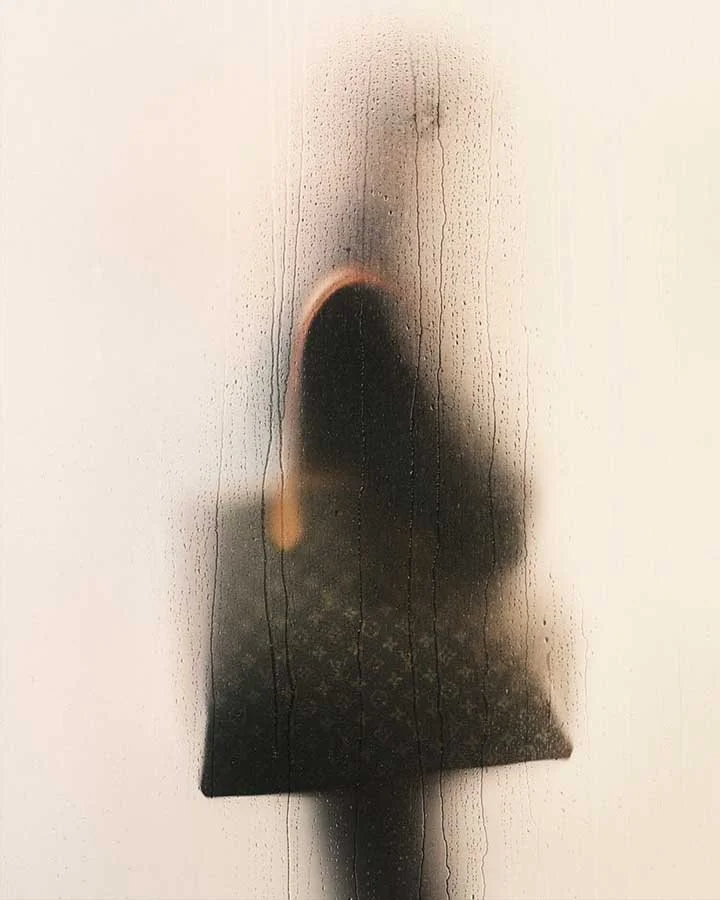 Pharrell Williams takes Louis Vuitton out in the rain