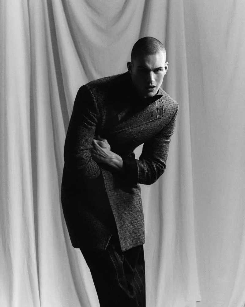 Samuel Watson by Cosimo Buccolieri for OFFLINE Issue 39 LE MILE Magazine Alban E. Smajli Sam wears a grey coat by CELINE, a blazer by BRUNELLO CUCINELLI, a shirt by BRIONI, pants by DOLCE & GABBANA