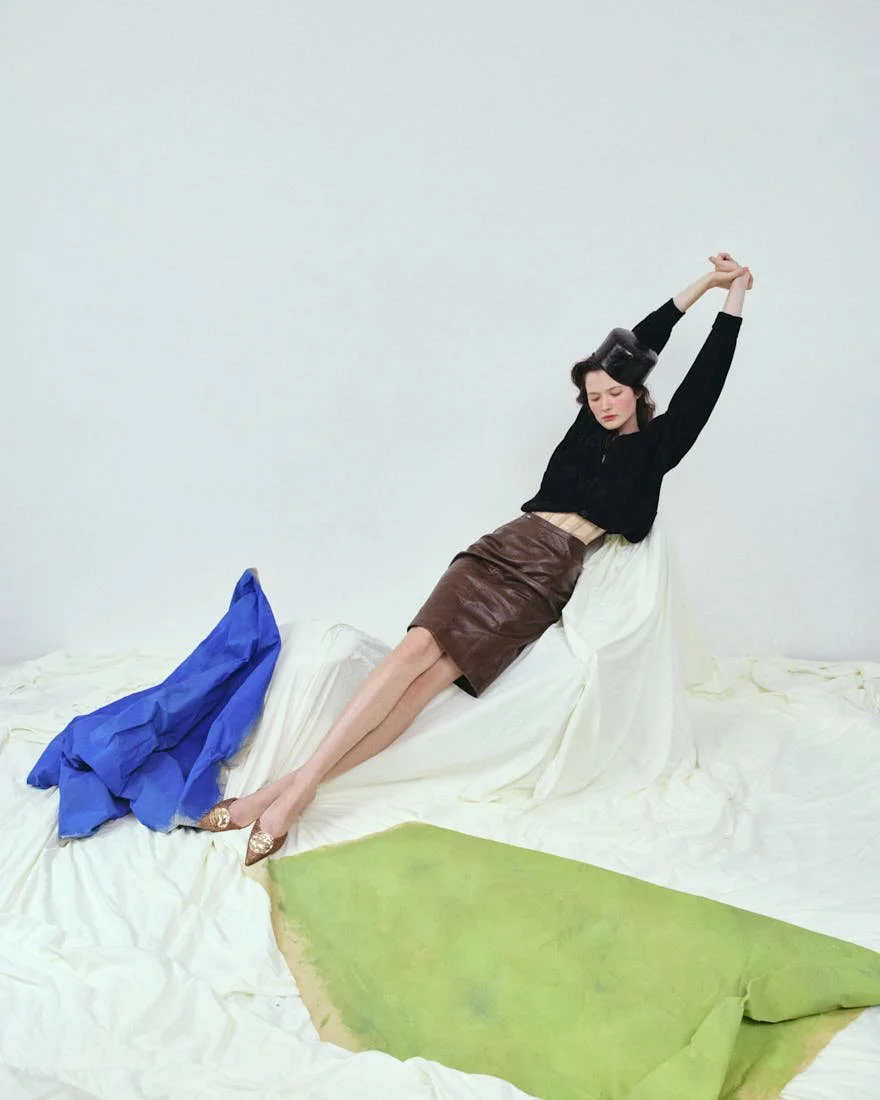 MADDIE STANLEY SS26 Editorial for LE MILE Magazine Maddie wears bomber jacket by VERSACE, corset by LORENZO SEGHEZZI, skirt by CASELL, shoes by APEPAZZA, and hat by BONFILIO