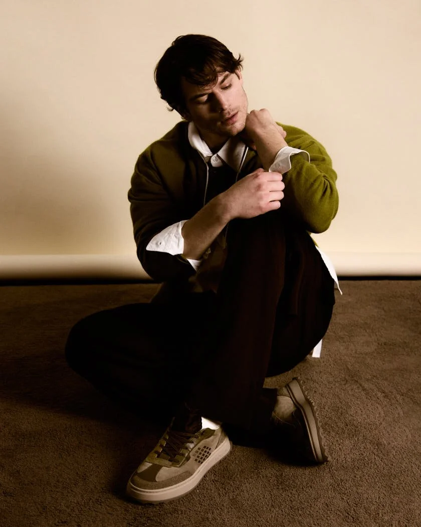 MATTEO GUERRIERI LE MILE Magazine Digital Cover SS26 Menswear Matteo wears a cardigan by EXTREME CASHMERE, a shirt by MORDECAI, pants by INSTITUTION, shorts by LUCA LARENZA, and shoes by BEPOSITIVE