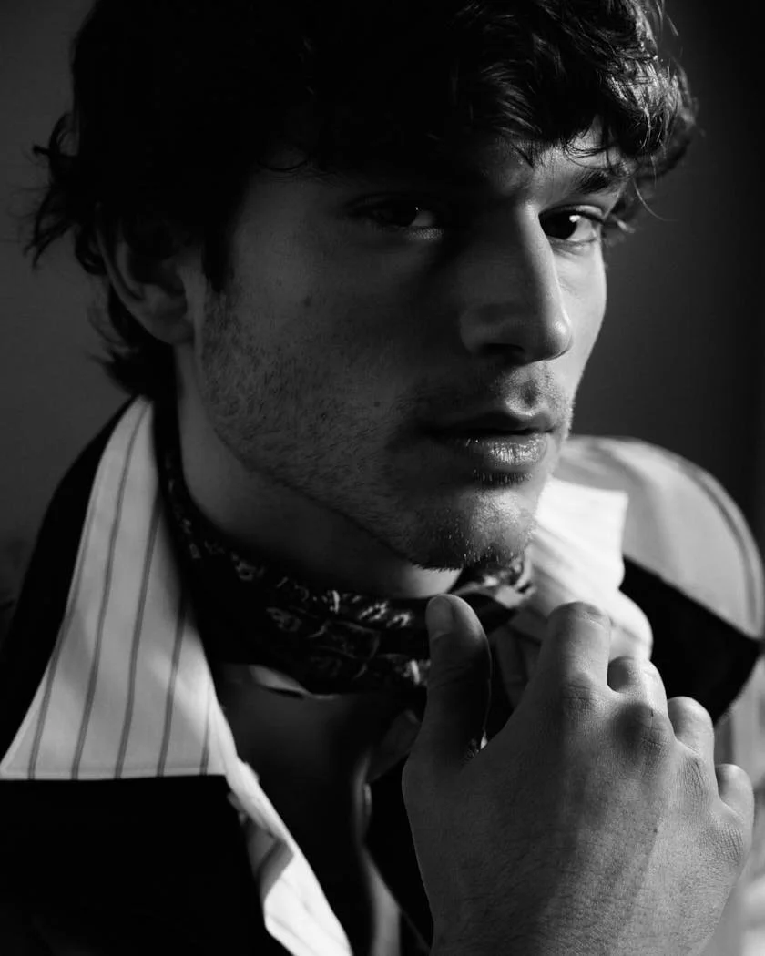 MATTEO GUERRIERI LE MILE Magazine Digital Cover SS26 Menswear Matteo wears a blazer by CANALI, a bomber and scarf by ETRO, a shirt by BOSS, pants by RANDOM IDENTITIES by Stefano Pilati, and shoes by CHURCH’S