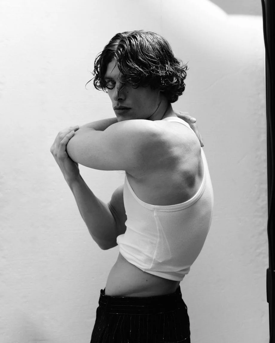 UMBERTO VILLAHERMOSA photo Cosimo Buccolieri Digital Cover SS26 for LE MILE Magazine Umberto wears a tank top by MICHAEL KORS, pants by DOLCE&GABBANA, and jewellery by LAG WORLD