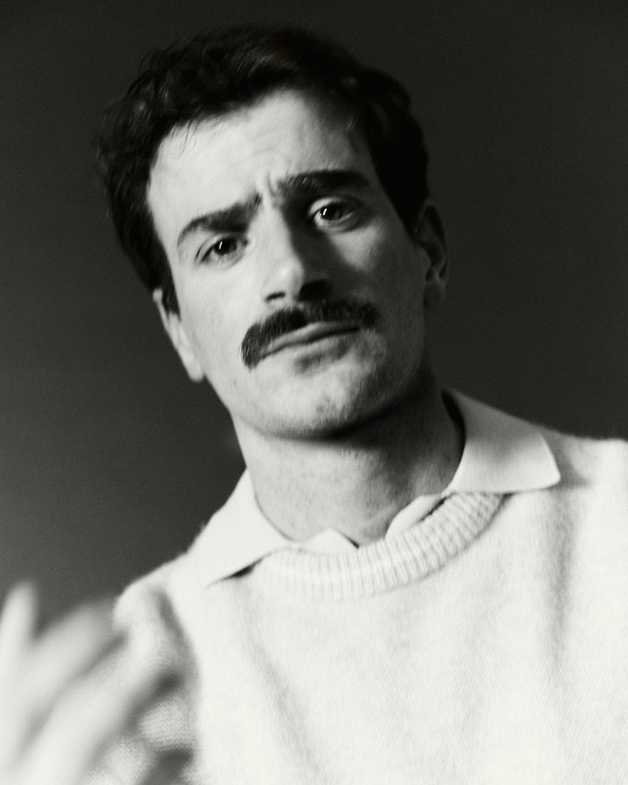 LE MILE MAGAZINE Giulio Ugolini podcast Dillo a Giulio photo by Cosimo Buccolieri Giulio wears a sweater by RANDOM IDENTITIES by Stefano Pilati, a T-shirt by MANUEL RITZ, and pants by HED MAYNER