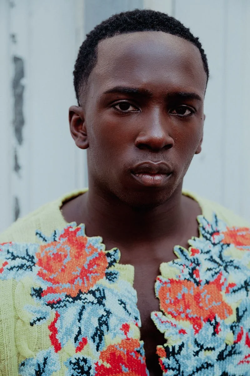 ARALOYIN OSHUNREMI for LE MILE Magazine Araloyin wears floral knitwear, blue denim and boots by DIESEL