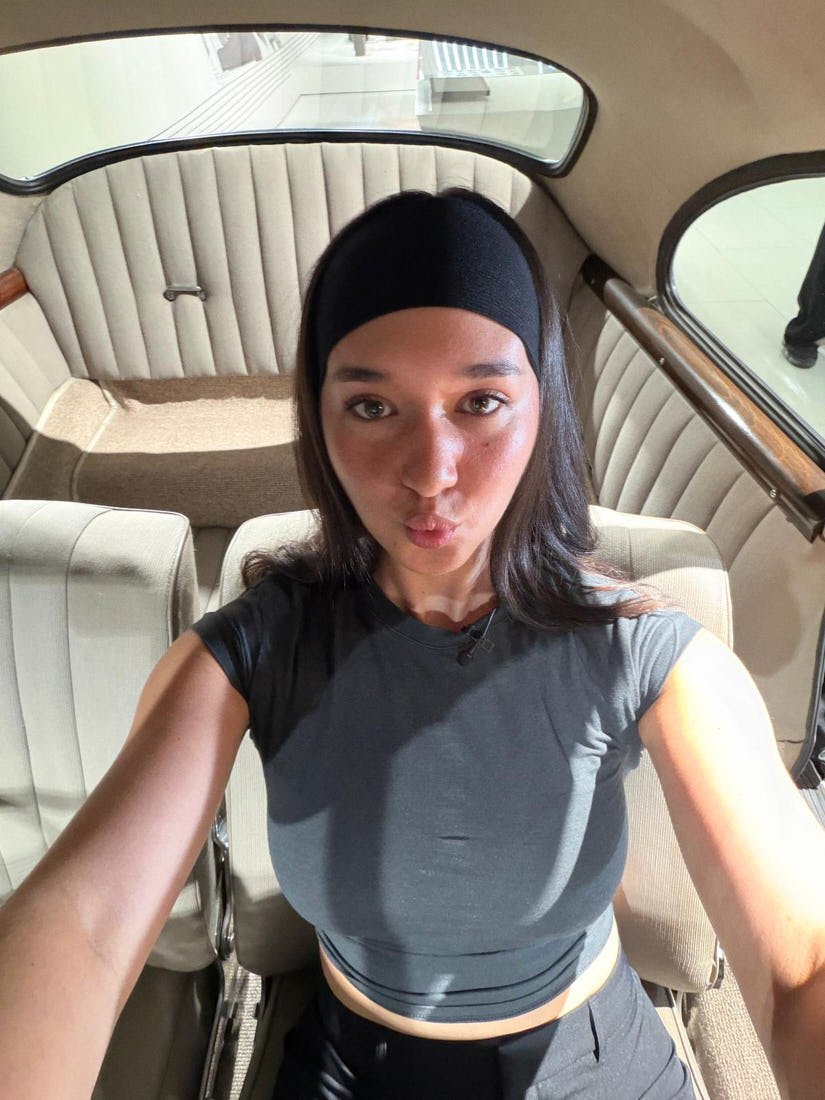 Eva Lys The personal Edit for LE MILE Porsche Tennis Grand Prix sitting in a car that was gifted to Ferdinand Porsche