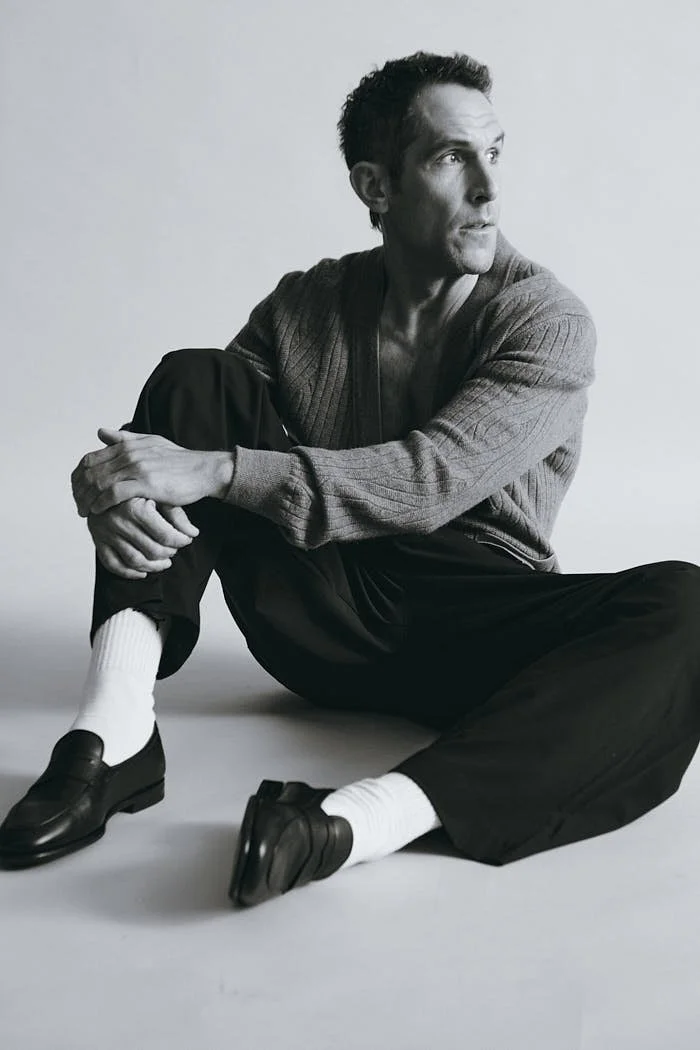 MANUEL LICCI LE MILE Magazine Interview photo Antonio Crotti  Manuel wears a cardigan by BRIONI, pants by FIVEFOURFIVE and shoes by SEBAGO