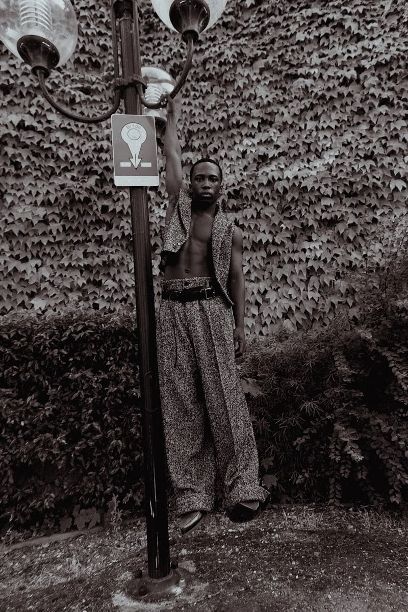 ARALOYIN OSHUNREMI for LE MILE Magazine Araloyin wears a vest, trousers and belt by DOLCE & GABBANA with shoes by DIESEL