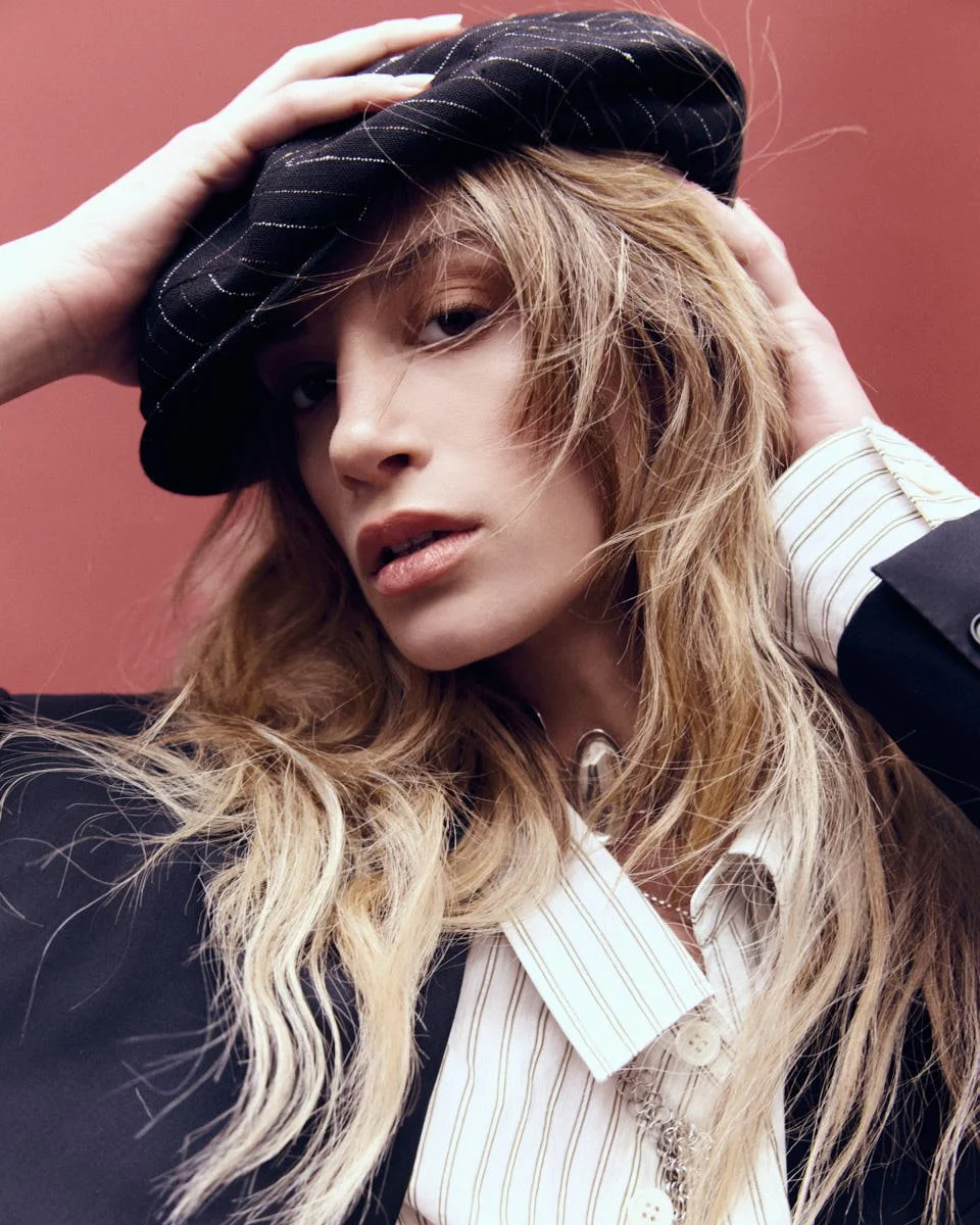 FRANCESKA NUREDINI Dancing Tides for LE MILE Magazine wearing Franceska wears a coat by DEAD COUTURE ICONS, a shirt by GRIFONI, skirts by MEIMEIJ and YALI, shoes by APEPAZZA, a hat by DOLCE&GABBANA, and jewellery by LAG WORLD