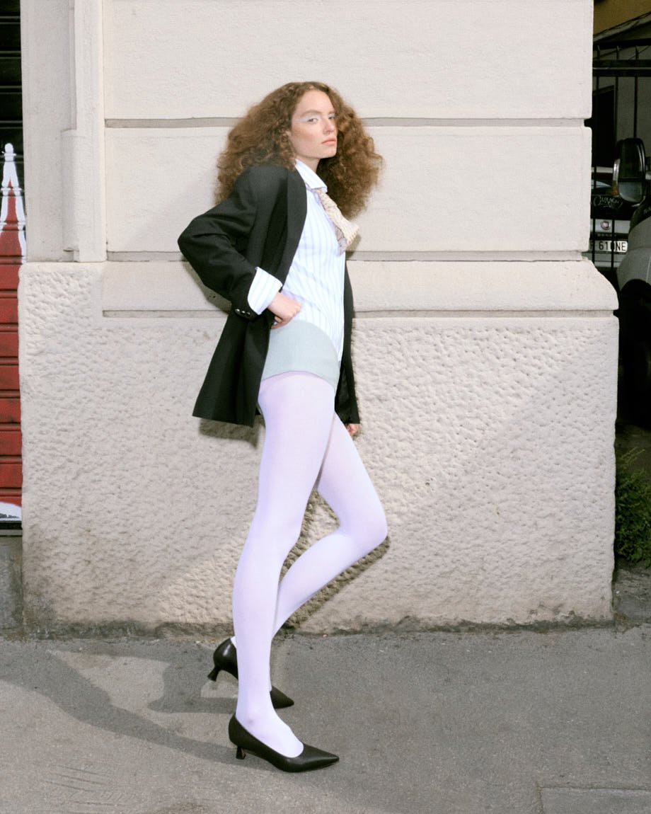 LE MILE Magazine Luisa Schumacher SS26 Editorial Luisa wears blazer by MANUEL RITZ, shirt and tie by PAL ZILERI, underwear by EXTREME CASHMERE, shoes by PAUL SMITH and tights by CALZEDONIA