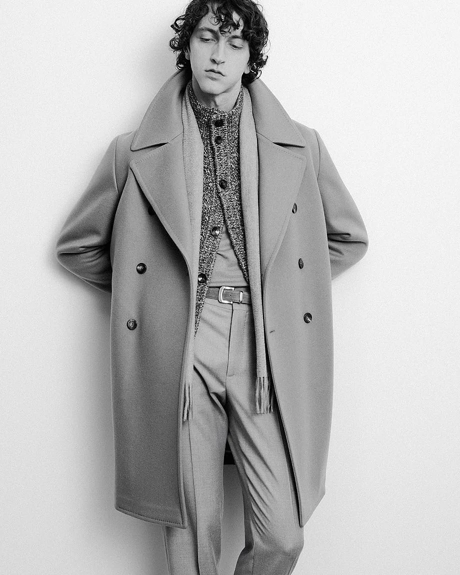 AGNONA Autumn/Winter 2026 menswear in black and white with a light double-breasted coat, textured cardigan and tailored trousers, LE MILE Magazine.