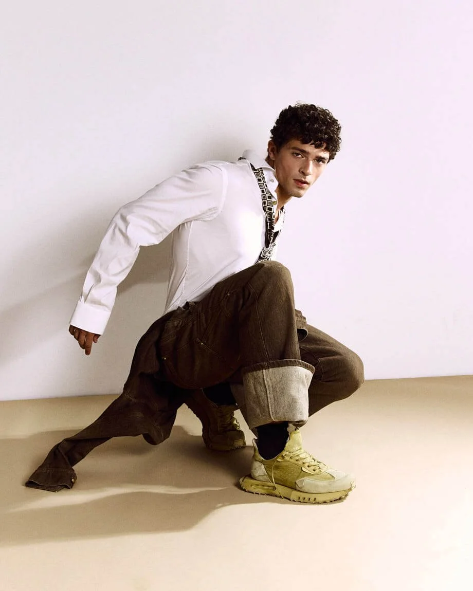 Rory Macleod Dancer Interview with LE MILE Magazine SS26 fashion digital cover Rory wears an overall by LOUIS VUITTON, shirt by KITON, shoes by BEPOSITIVE and scarf by TAGLIATORE