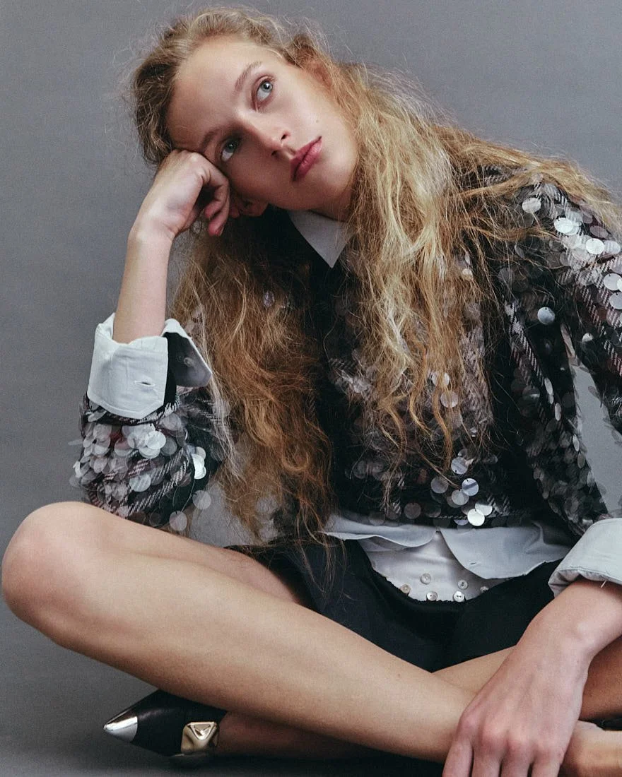KIRA ALFERINK for LE MILE Magazine Digital Fashion Editorial SS26 photo by Antonio Crotti Kira wears cardigan and sweater by N21, shirt by SON OF A TAILOR, dress by VIVETTA and shoes by APEPAZZA