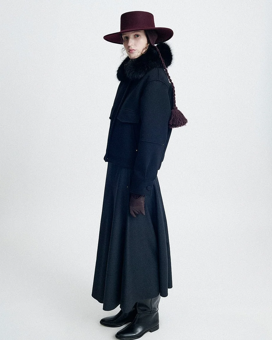 AGNONA Autumn/Winter 2026 womenswear with burgundy wide-brim hat, dark jacket, fur collar and long skirt, LE MILE Magazine.