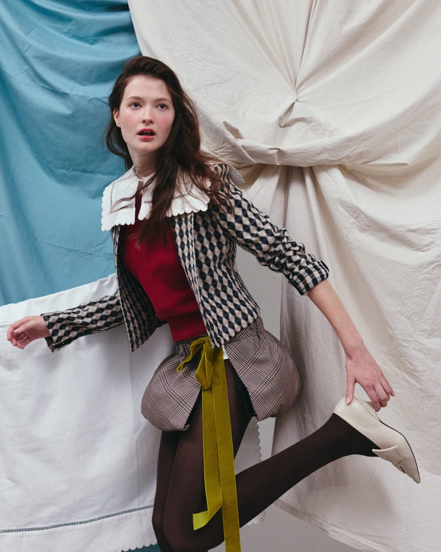 MADDIE STANLEY SS26 Editorial for LE MILE Magazine Maddie wears cardigan by MSGM, vest by FILIPPO DE LAURENTIIS, shirt by VENERDÌ POMERIGGIO, skirt by MAREA, and shoes by VIVETTA