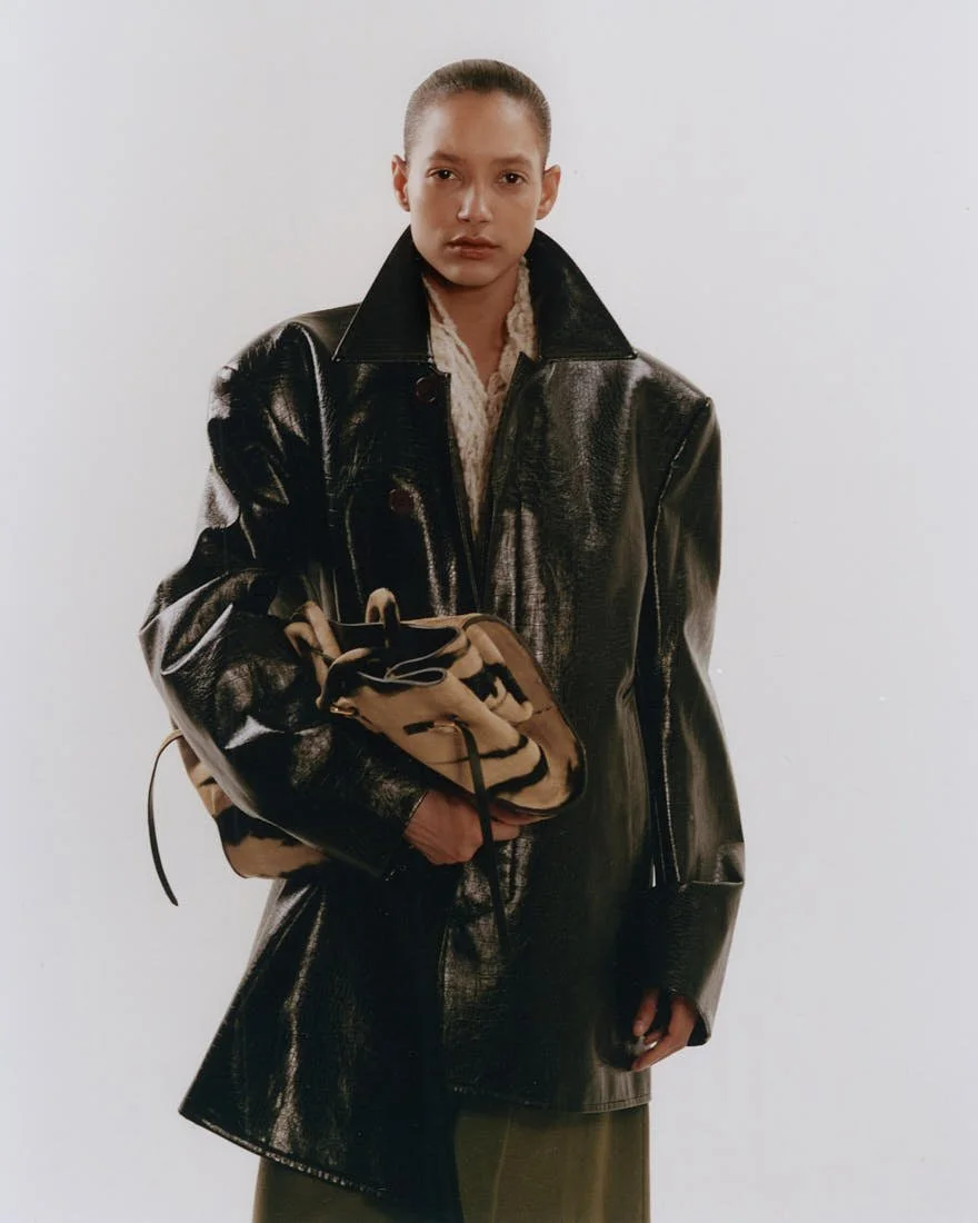 CHRIS SAULNIER LE MILE Magazine NYC WINTER BREATH FW25 Story Maria wears a green skirt and knit fur top by Pier Antonio Gaspari, a coat by Wàngda, and a bag by KALIEDDIE.