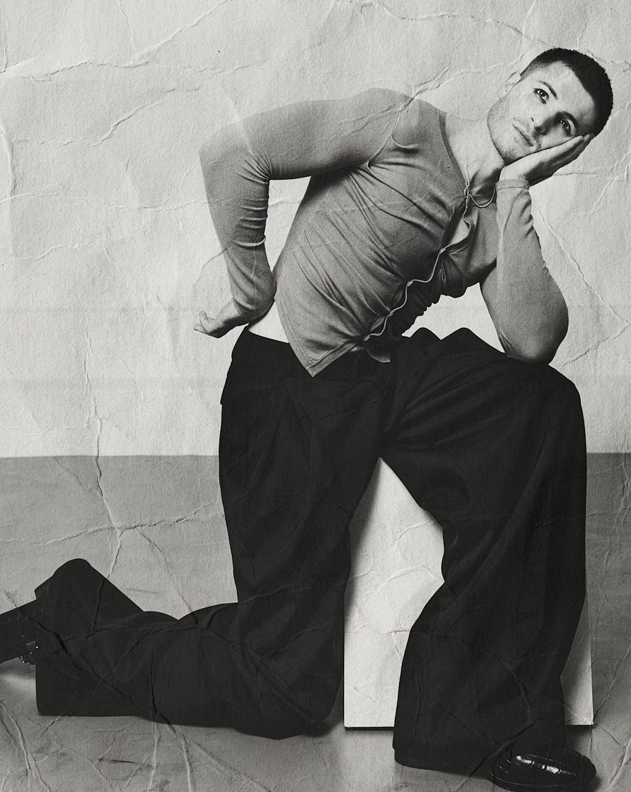 Kieron Moore LE MILE Magazine Cover Interview with Alban E. Smajli Kieron wears cardigan by CAMPER LAB, trousers and shoes by AMIRI and necklace by ALT PARIS