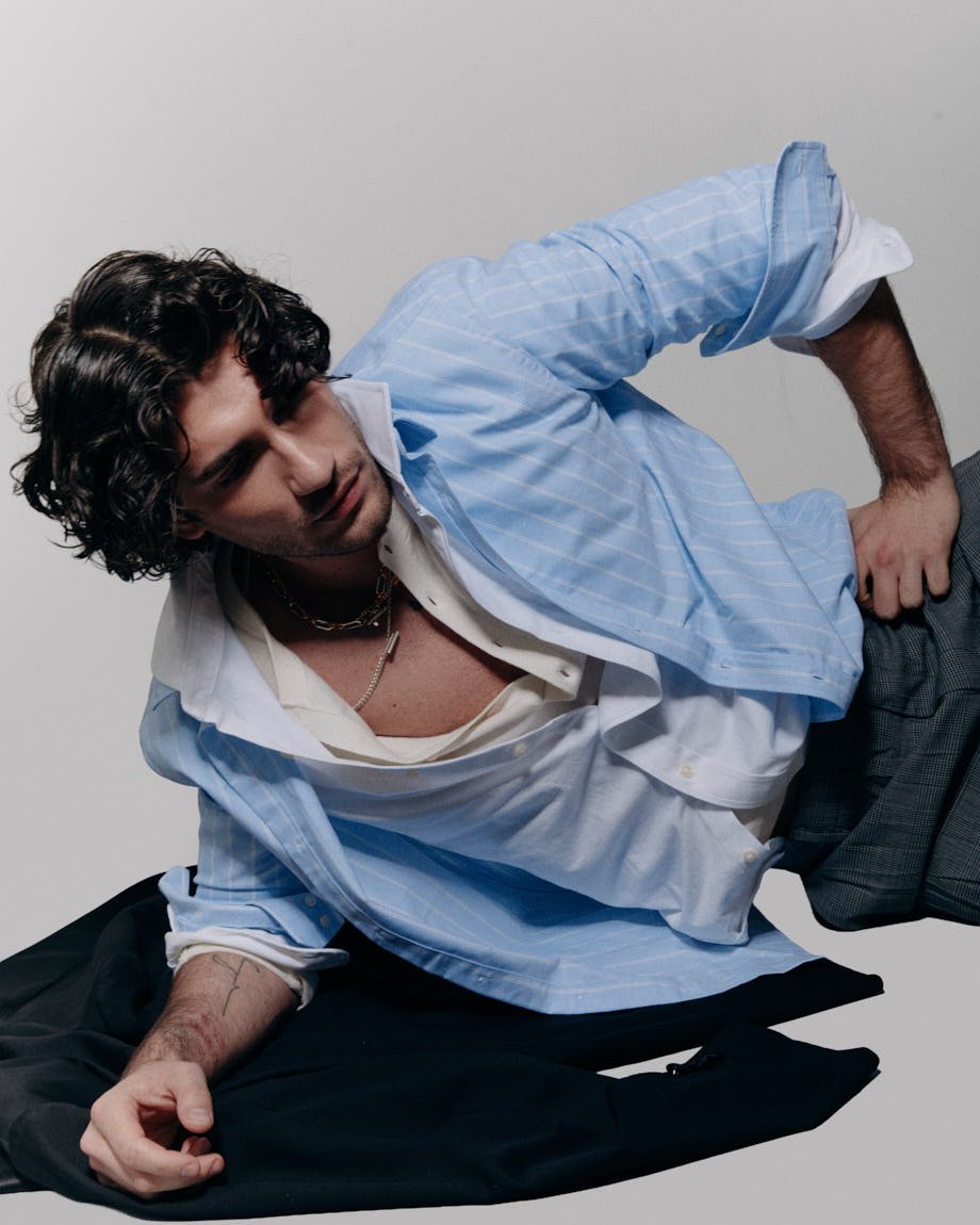 Michelangelo Vizzini photo by Andrea Cenetiempo for LE MILE Magazine CoverSS26 wearing shirts by SON OF A TAILOR and POLO RALPH LAUREN, pants by MOSCHINO, shoes by CHURCH’S, and jewellery by LAG WORLD