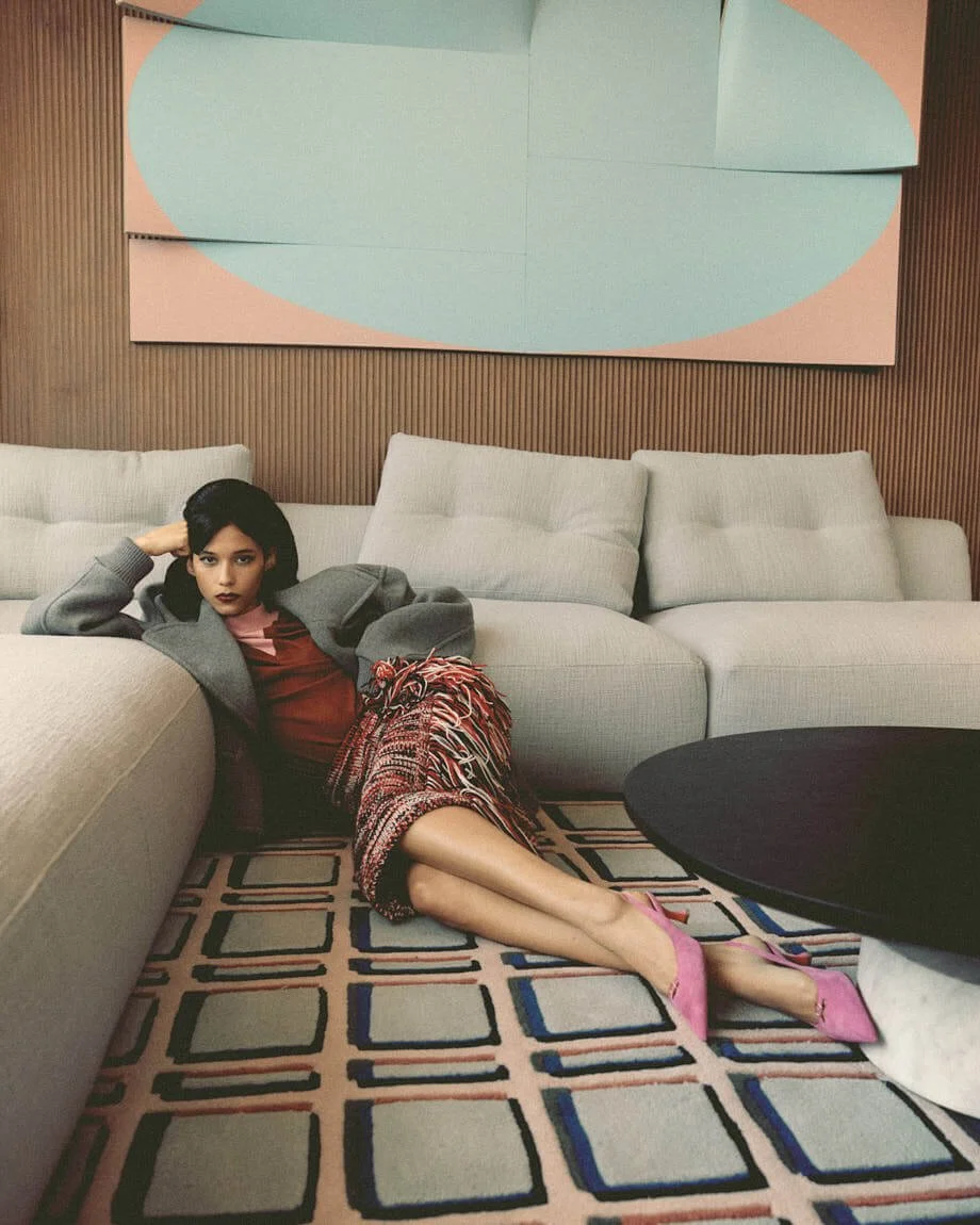 MARIA MAVAREZ LE MILE Magazine photo Cosimo Buccolieri SS26 Fashion Editorial Maria wears coat by MOSCHINO, sweater by TOD’S, skirt by N°21 and shoes by SANTONI
